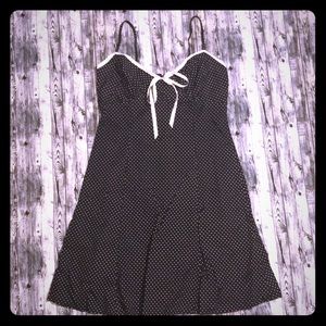 Sleeveless black dress w/does dots